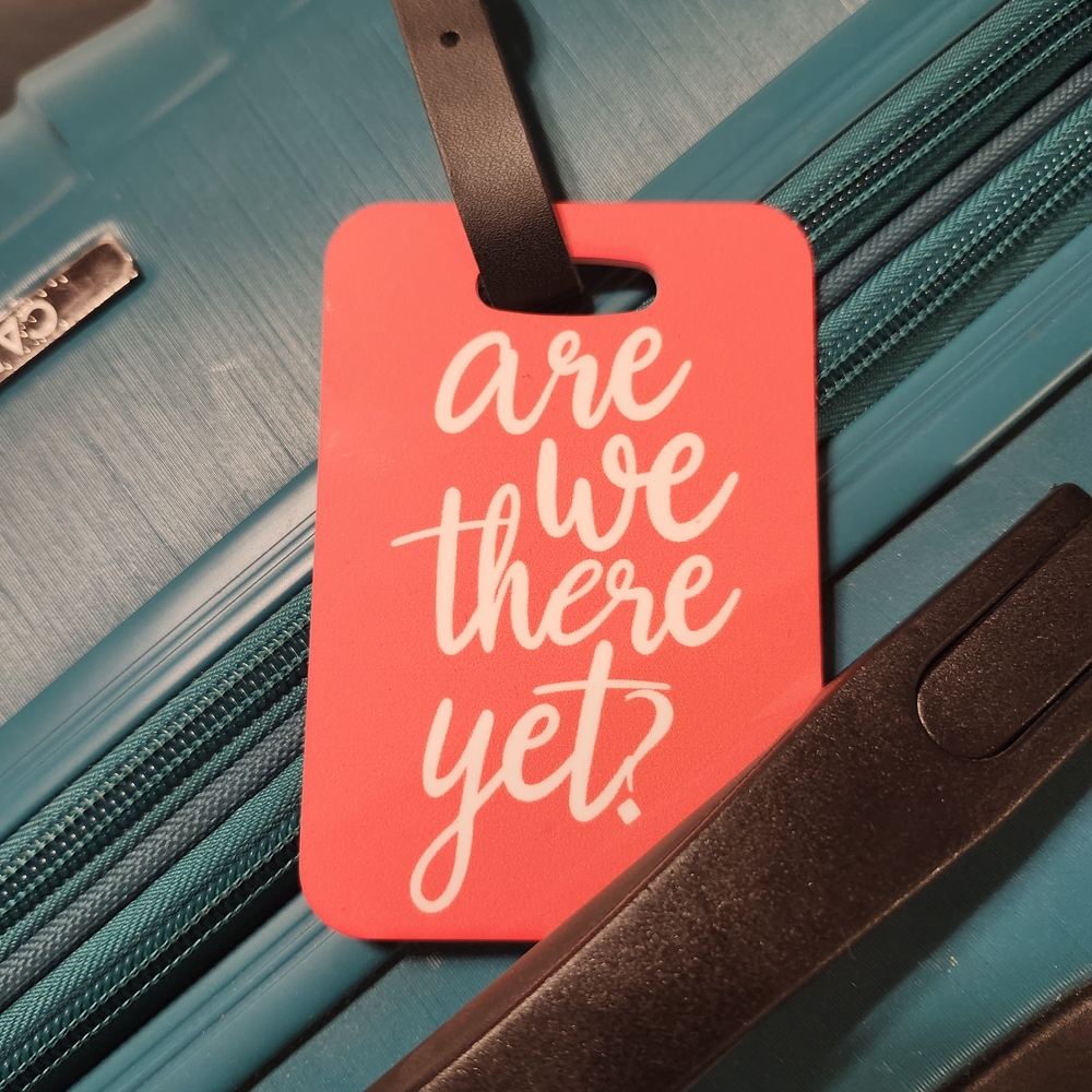 Red Luggage Tag with White Text